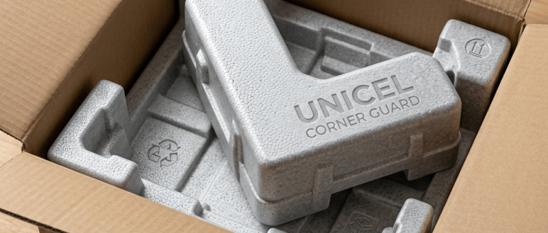 Transparent corner guard labeled UNICEL on the corner of a TV screen